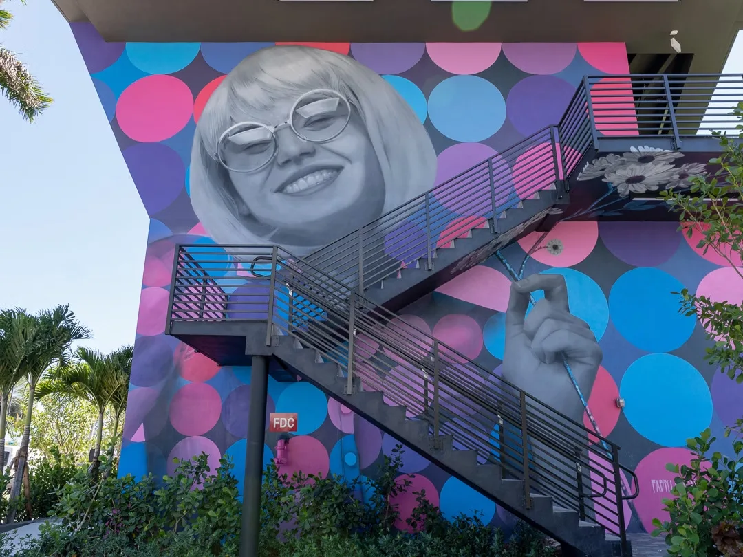 Circle of Smiles — mural by Carmo in Hallandale Beach, FL