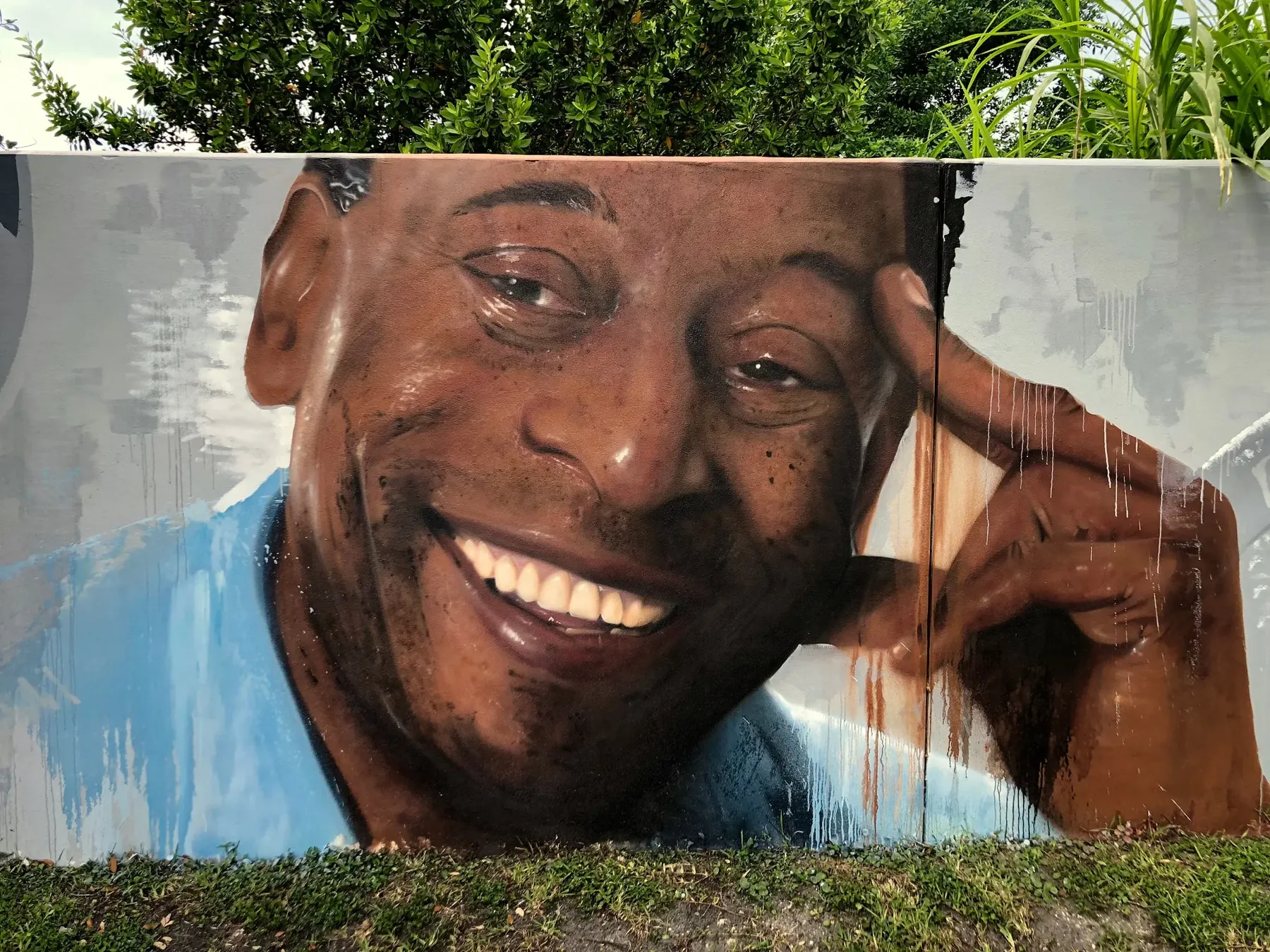 The King’s Smile — Pelé — mural by Carmo in Miami, FL